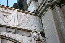 A plaque on the Osii Loggia in Piazza Mercanti ("Merchant square") in Milan, built in 1316 by Scoto da San Gimignano for Matteo I Visconti