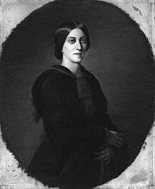 Three-quarter oval portrait of a slender woman aged about 30, garbed in black. Her deep-set eyes gaze solemnly over the viewer's shoulder. Her dark, straight hair is parted in the centre without a fringe, combed over the ears, and pulled back in a low bun.