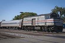 Locomotive at the end of a passenger train on a grade crossing