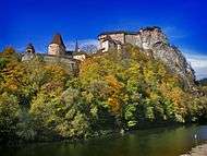 A fortress built on cliffs over a river