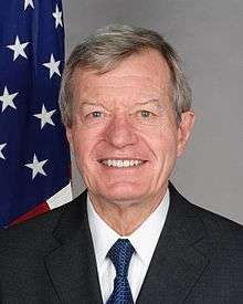 Upper-body portrait of a man in a suit.