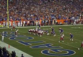 Teams in formation near the end zone